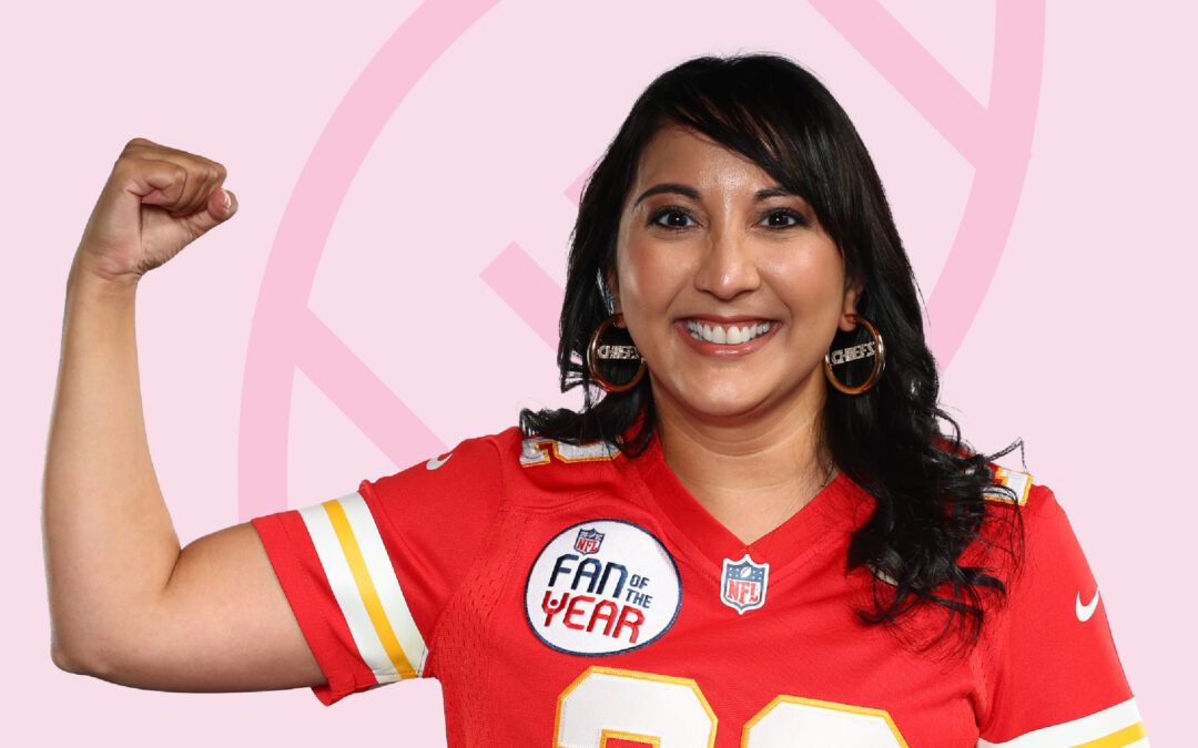 Dr. Patel wearing her Fan of the Year Chiefs Jersey
